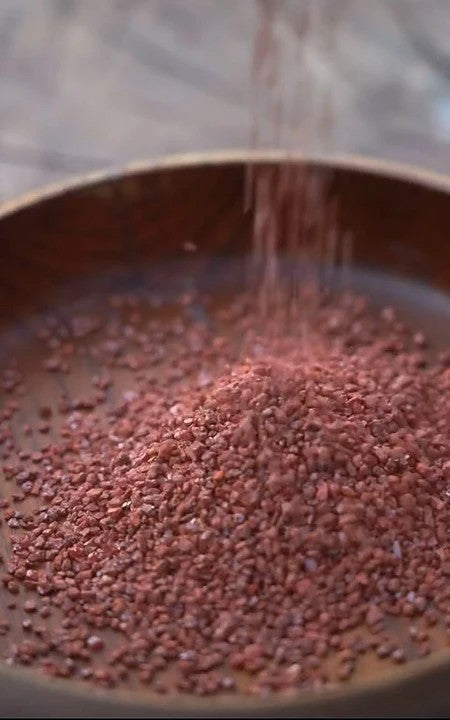 Artisan hand-polishing cinnabar beads using Zhou Dynasty alchemical methods